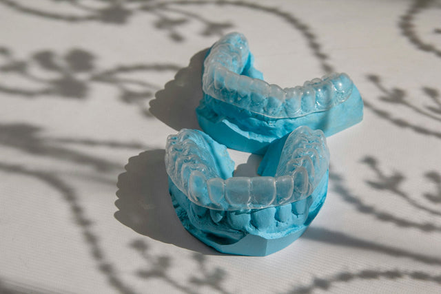 Clear bleaching trays thermoformed on blue dental models