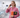 Dental office manager on the phone holding a UPS envelope