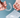 Hands holding a pair of clear aligners