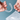 Hands holding a pair of clear aligners