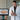 Dentist holding an intraoral scanner next to its screen