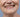 Close-up of an older adult's smile with short, flattened worn incisal edges