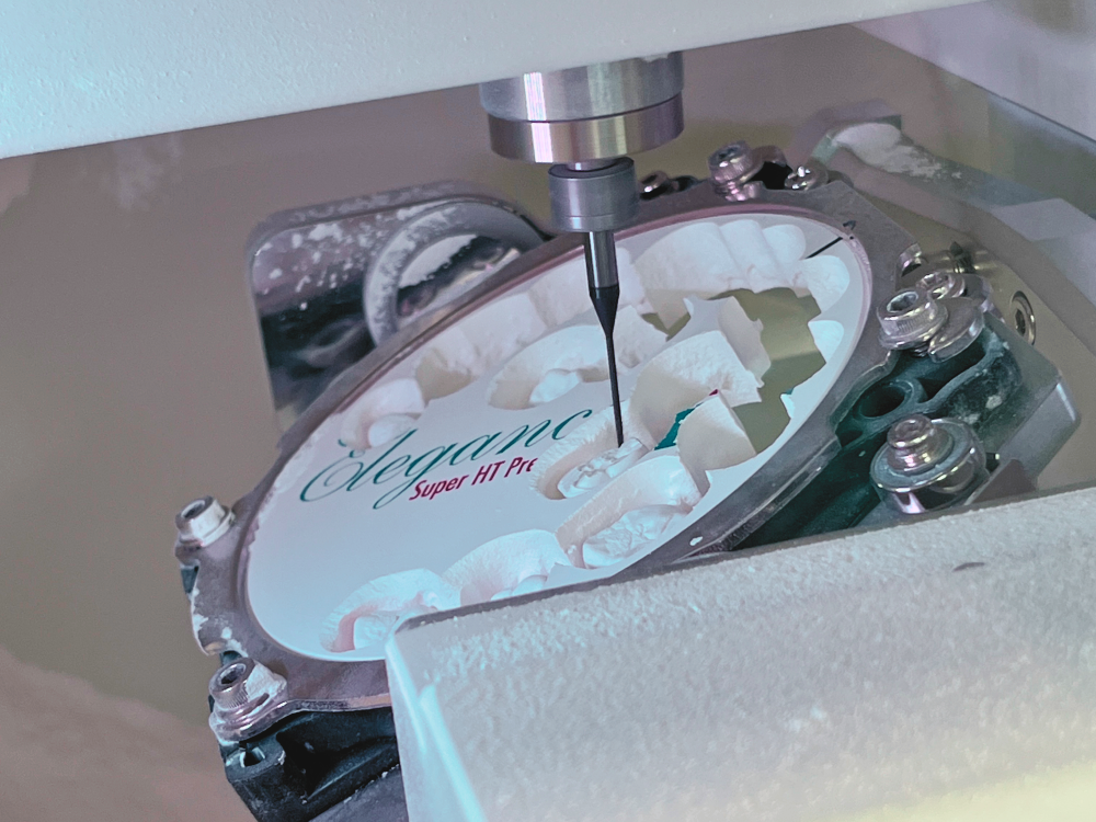 Zirconia disc during milling, with crowns in progress