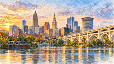 Watercolor illustration of the Cleveland skyline at sunset over the Cuyahoga River, with Terminal Tower and the Detroit-Superior Bridge